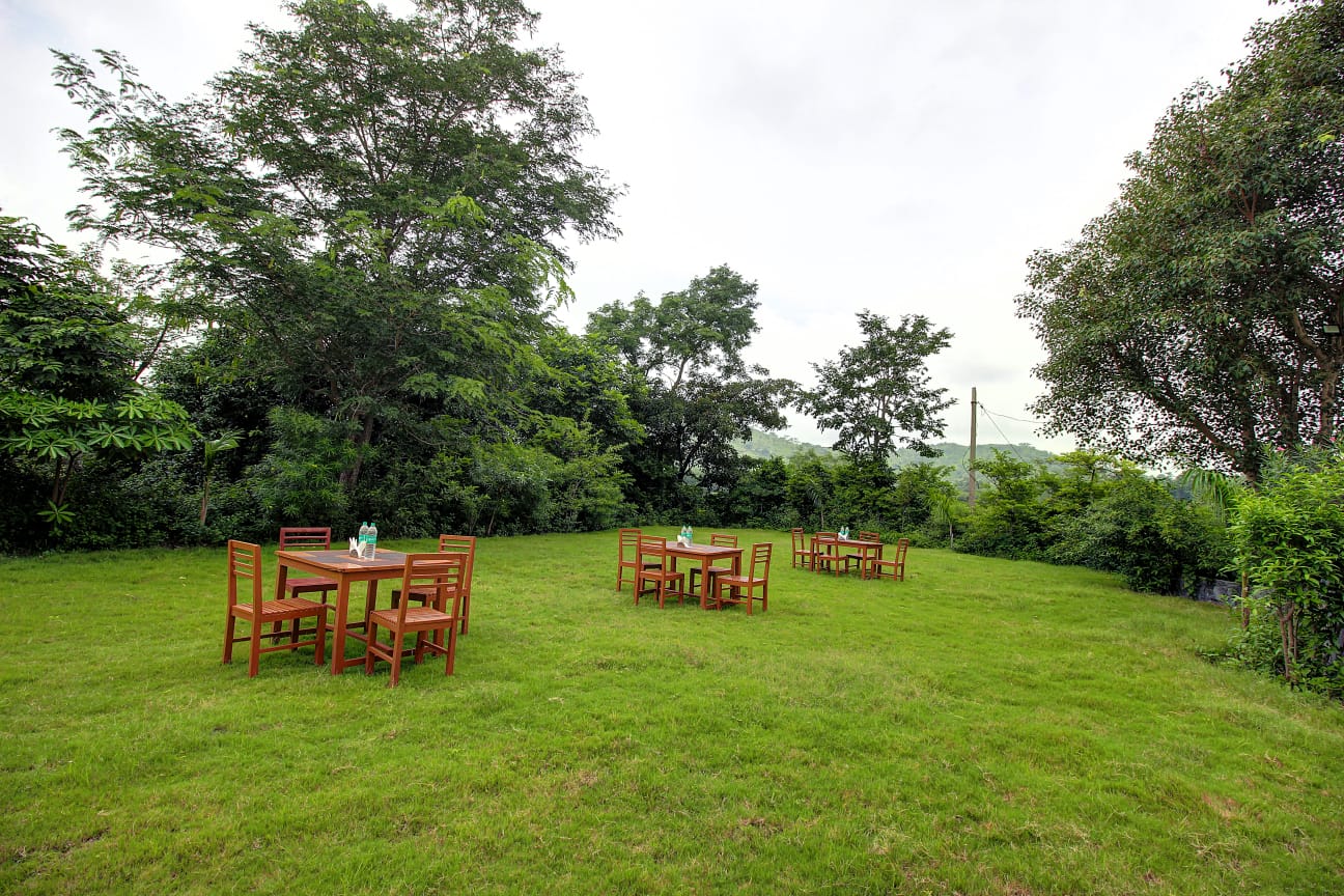 Evening garden setup for bonfire and stargazing at Takhat Villa